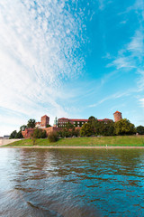 A beautiful view of the Wawel Castle from the Vistula River on a sunny day at sunset. Cracow, Poland.