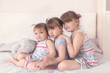 Three sibling sisters  in real interior, lifestyle