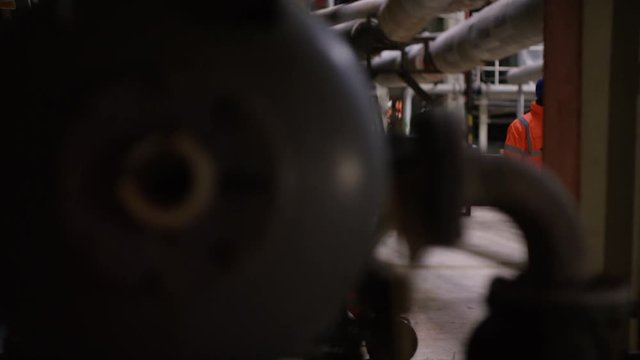  Time lapse of busy team of engineers working together inside power station