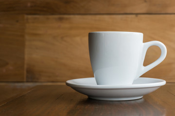 Hot coffee on a wooden table