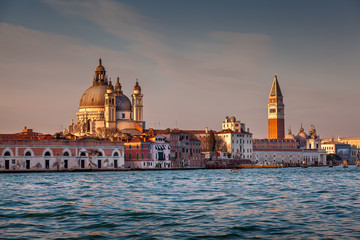 Fototapeta premium Santa Maria della Salute Church and Saint Mark's Campanile in the Evening, Venice, Italy