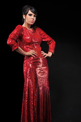 young fashion brunette woman posing in red dress