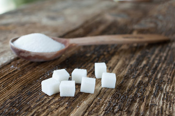 Wooden spoon sugar on the table