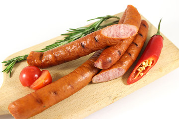 Grilled sausages with rosemary and hot peppers