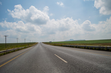 Typical Pastoral Landscape with Highway close to Golden Gate Highlands National Park in South Africa’s Freestate