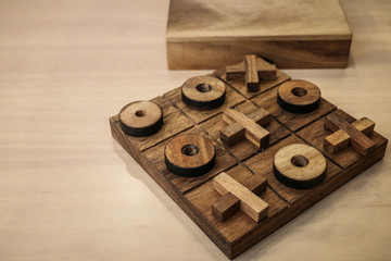 right or wrong with tic tac toe game on the wood table