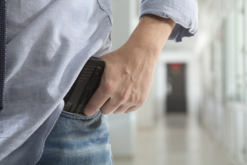 Killer with a gun in the hallway