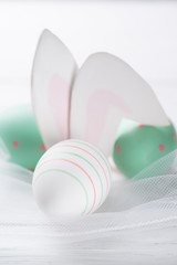Easter eggs with cute rabbit ears, easter background, small depth of field