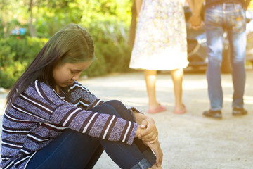 Sadness woman with behind background of boyfriend with other