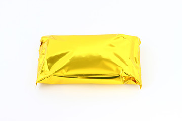 Gold packing. Package of golden foil isolated on a white background. - 143415233