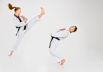 The karate girl and boy with black belts © master1305