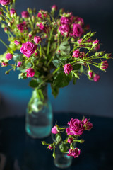 The beautiful vases with flowers  stand on the table