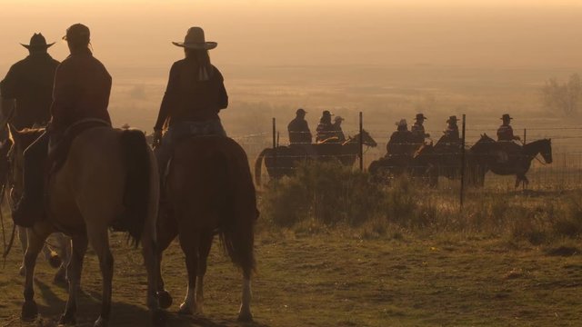 Cowboys on horses getting ready for a round up event