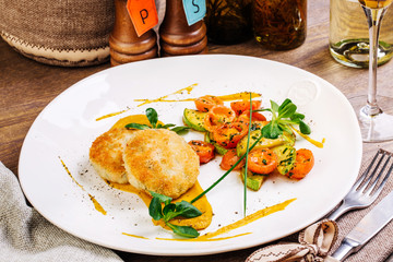Chicken cutlets, grilled zucchini and fresh vegetable salad