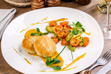 Chicken cutlets, grilled zucchini and fresh vegetable salad