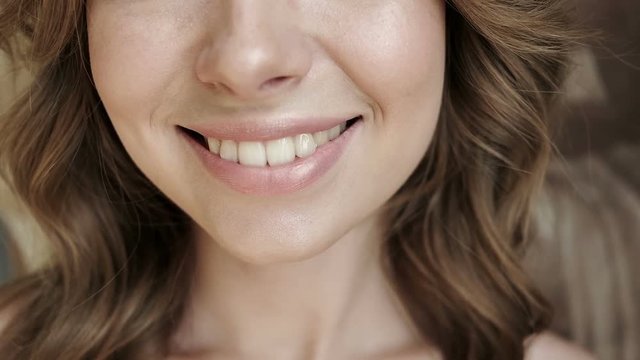 Beauty portrait, beautiful woman smiling at camera. White teeth