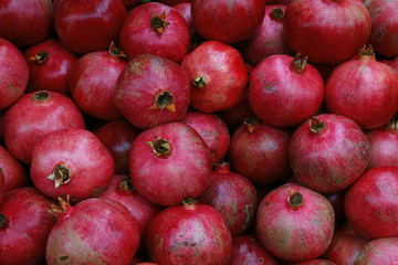 Fresh red ripe pomegranates high angle