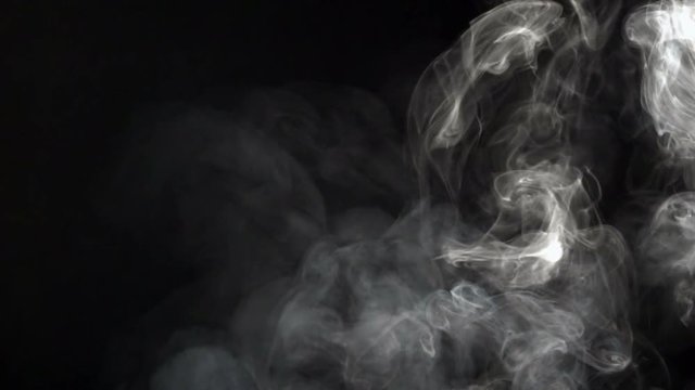 Smoke on a black background in slow motion. 