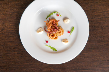 Calamari freshly prepared seafood on a white plate