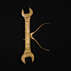 Letter K. Alphabet made of golden repair tools