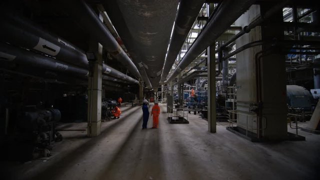  Engineer in power station carrying out maintenance & checking the machinery