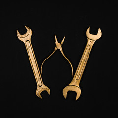 Letter W. Alphabet made of golden repair tools