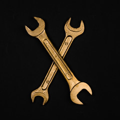 Letter X. Alphabet made of golden repair tools