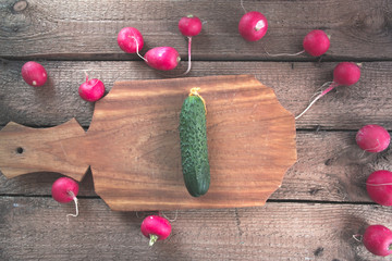 Fresh cucumber on a wooden background.