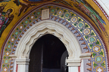 Decorated arch and mosaic over the entrance of the church