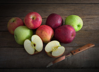 Pile of fresh apples put on old wooden background