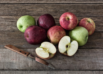Pile of fresh apples put on old wooden background