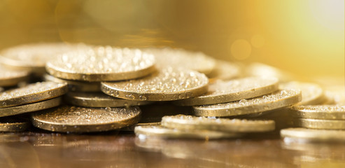 Website banner of golden coins closeup - money savings concept