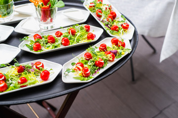 Plates with vegetable mix, food snacks on an event party, wedding, birthday or dinner