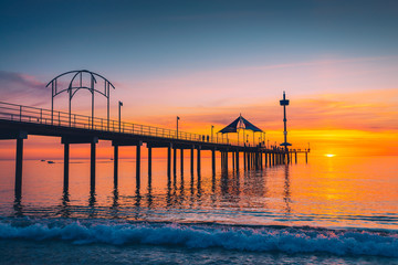 Fototapeta na wymiar Brighton Jetty with people at sunset