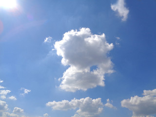 Fototapeta premium Dazzling Sunny Blue Sky with White Fluffy Cloud, Thailand 