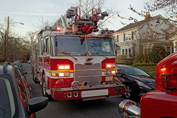 Dusk residential neighborhood fire emergency.