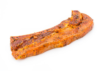 Spicy marinated spare ribs barbecued on the white background.