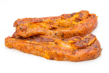 Spicy marinated spare ribs barbecued on the white background.