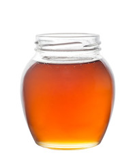 Glass jar full of honey isolated on white background