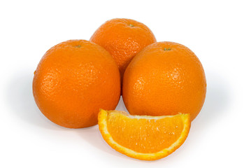 Three oranges and slice isolated