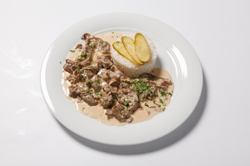 stewed meat with white rice and mashroom sauce