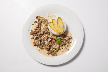 stewed meat with white rice and mashroom sauce