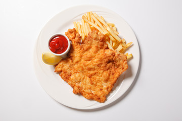 Fried fish and chips on the white plate