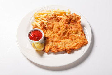 Fried fish and chips on the white plate