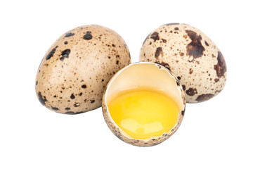 Broken raw quail egg on white background