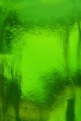 Texture of glass of green wine bottle, abstract background