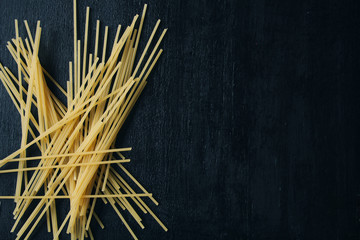 spaghetti on a black background