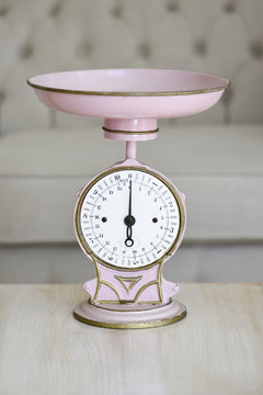 Old pink weighing scale to take care of its line