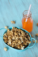 Caramel Popcorn In Blue Tin Bucket With Orange Soda Pop