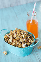 Blue Tin With Caramel Popcorn and Orange Soda Pop Snack